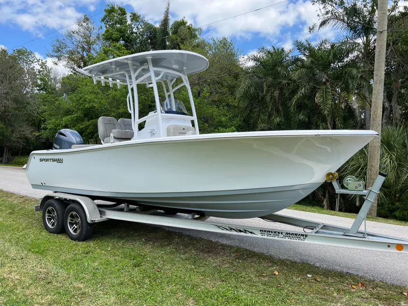 Slide: The Image of 2023 Sportsman Open 212 Platinum boat on a trailer, side view. - 0
