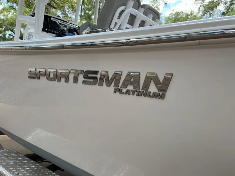 Slide: The Image of 2023 Sportsman Open 212 Platinum boat side view with logo. - 12