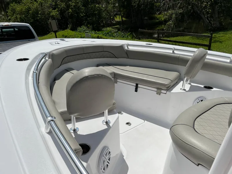 Slide: The Image of 2023 Sportsman Open 212 Platinum boat with cushioned seating and sleek design. - 17