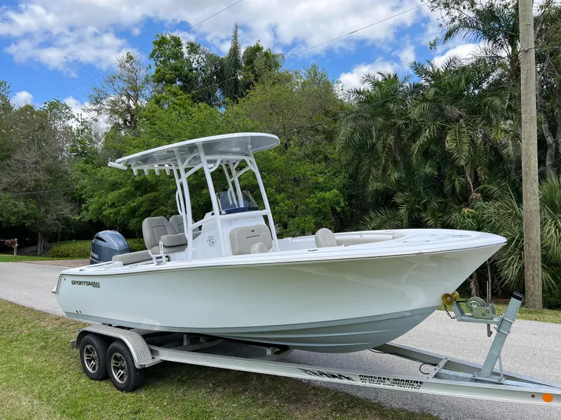 Slide: The Image of 2023 Sportsman Open 212 Platinum boat on trailer, side view. - 2