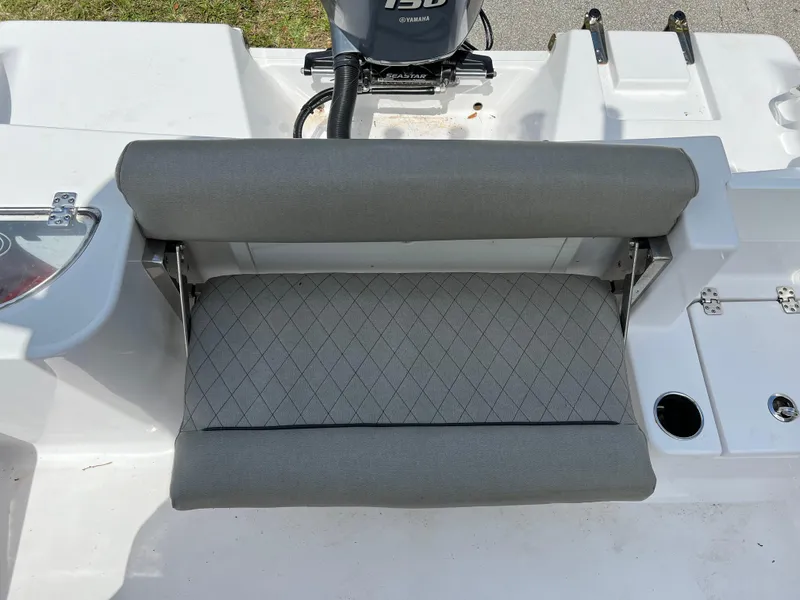Slide: The Image of 2023 Sportsman Open 212 Platinum boat with cushioned seating and motor. - 20