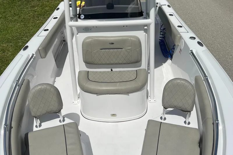 Slide: The Image of 2023 Sportsman Open 212 Platinum boat interior with cushioned seating. - 28