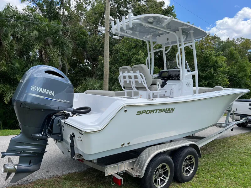 Slide: The Image of 2023 Sportsman Open 212 Platinum boat on trailer with Yamaha outboard motor. - 3