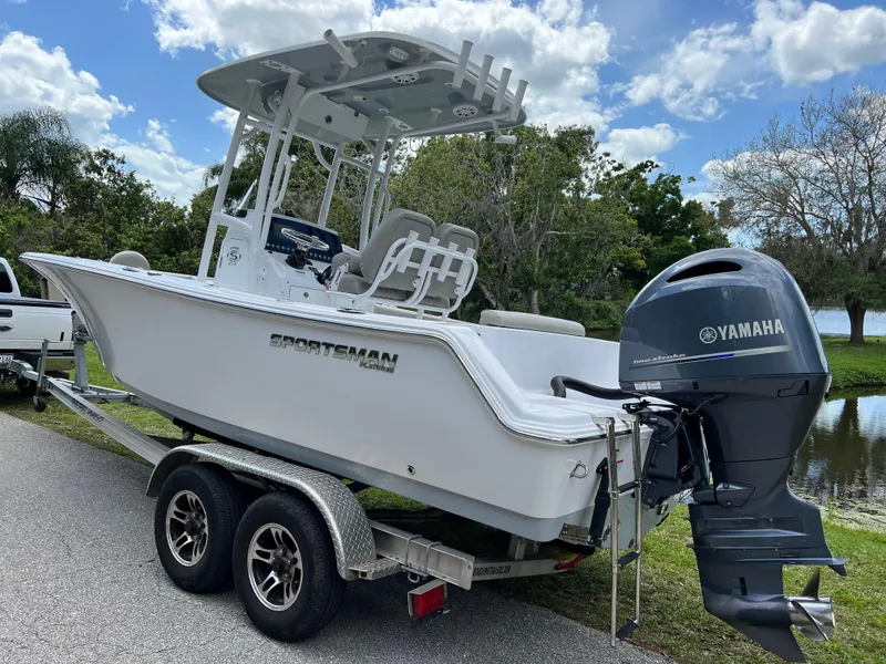 Slide: The Image of 2023 Sportsman Open 212 Platinum boat on trailer with Yamaha outboard motor. - 6