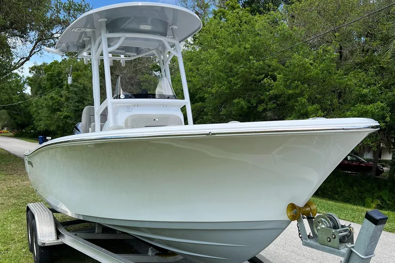 Slide: The Image of 2023 Sportsman Open 212 Platinum boat on trailer, side view. - 9