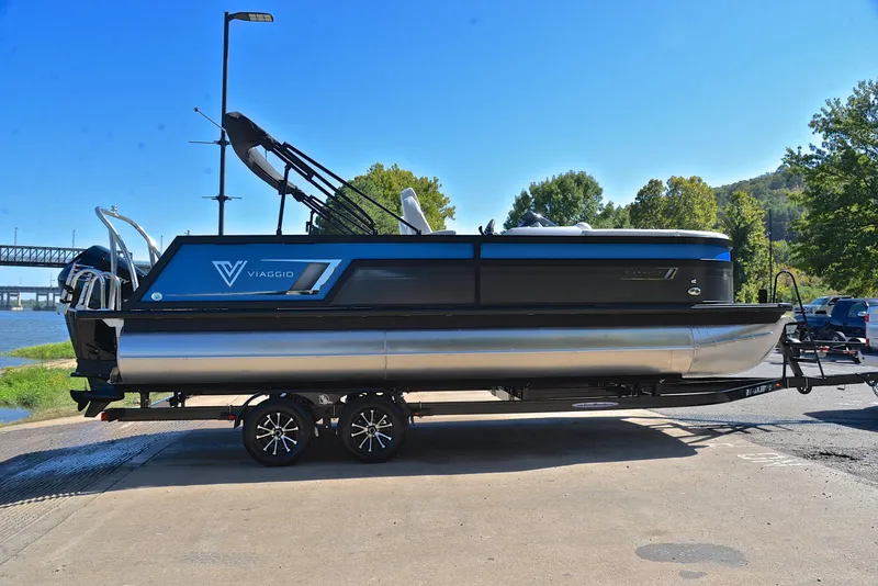Slide: The Image of 2023 Viaggio D23S Platinum pontoon boat on a trailer at a boat launch. - 15
