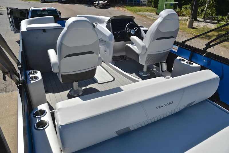 Slide: The Image of 2023 Viaggio D23S Platinum boat interior with white seating and modern dashboard. - 20