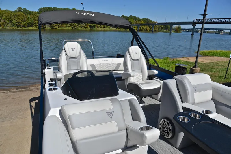 Slide: The Image of 2023 Viaggio D23S Platinum boat with luxurious seating on a serene lake. - 22
