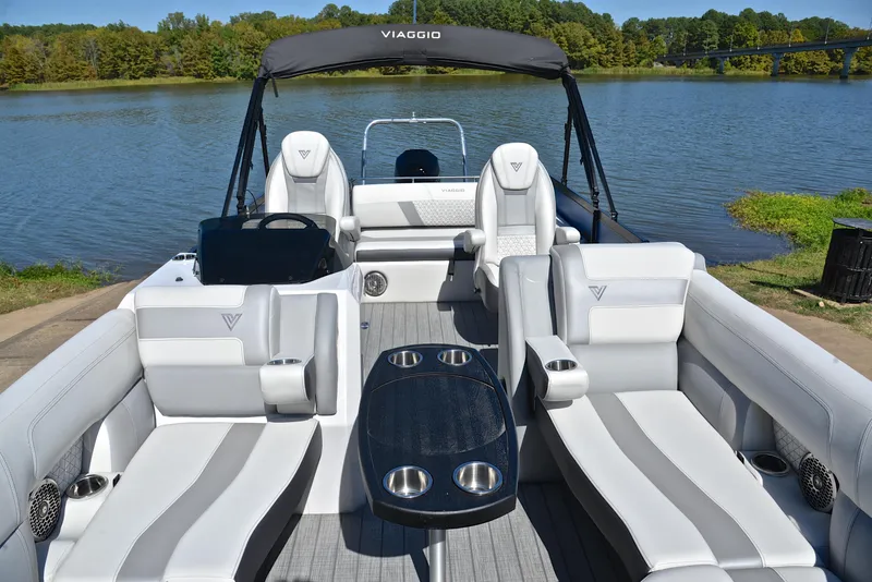 Slide: The Image of 2023 Viaggio D23S Platinum boat with luxurious seating on a serene lake. - 25