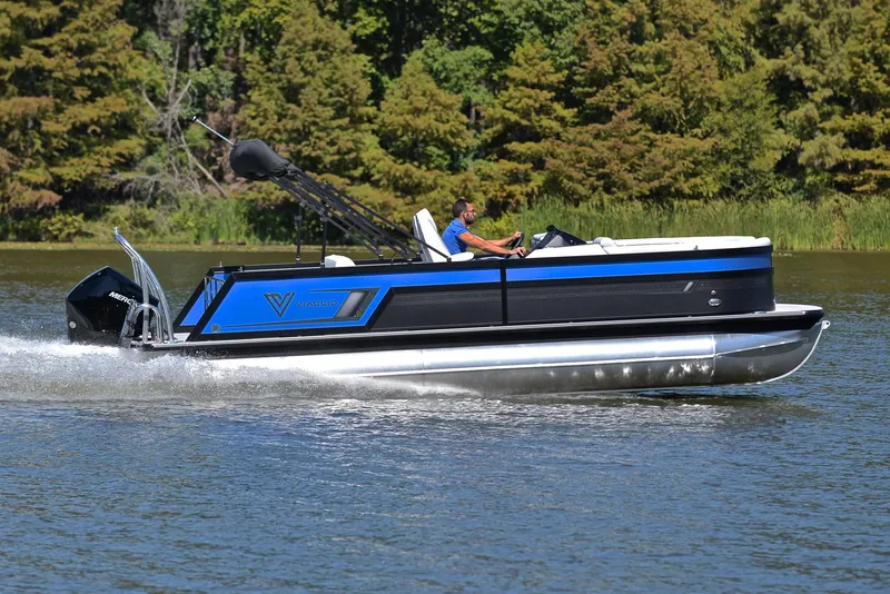 Slide: The Image of 2023 Viaggio D23S Platinum pontoon boat cruising on a lake. - 3