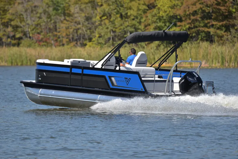 Slide: The Image of 2023 Viaggio D23S Platinum pontoon boat cruising on a lake. - 4