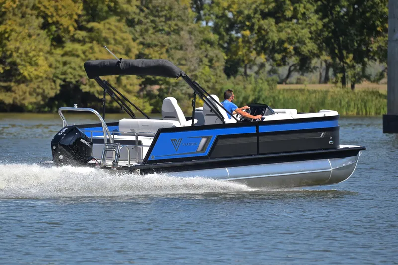 Slide: The Image of 2023 Viaggio D23S Platinum pontoon boat cruising on a lake. - 5