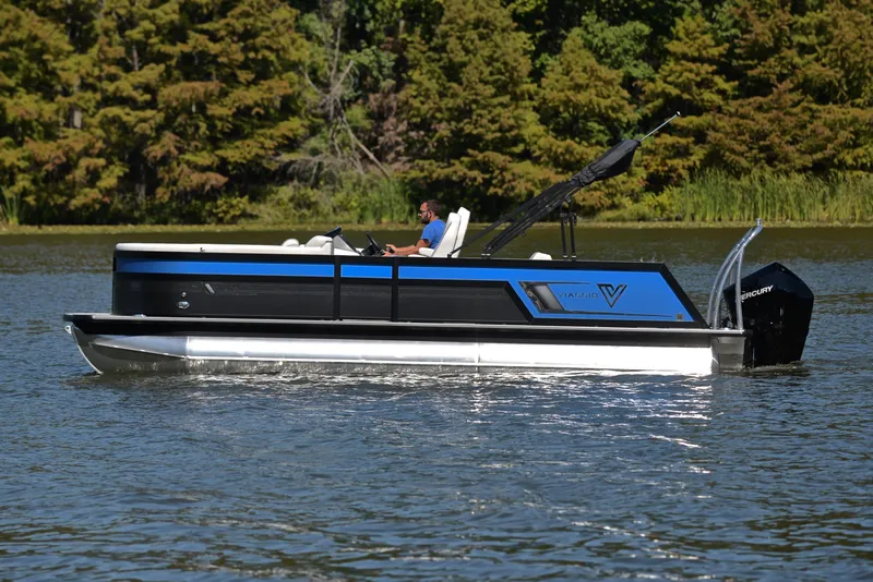 Slide: The Image of 2023 Viaggio D23S Platinum pontoon boat cruising on a lake. - 8