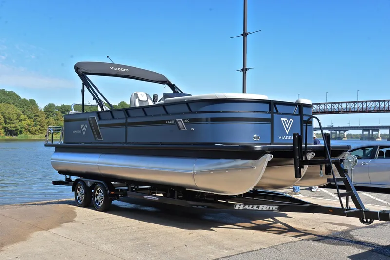 Slide: The Image of Viaggio L22Q 2023 pontoon boat on trailer by the water. - 16