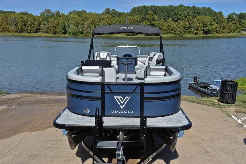 Slide: The Image of 2023 Viaggio L22Q pontoon boat at a lakeside dock. - 17
