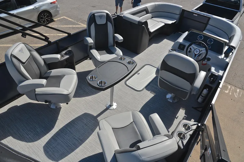 Slide: The Image of 2023 Viaggio L22Q pontoon boat interior with luxurious seating and table. - 19