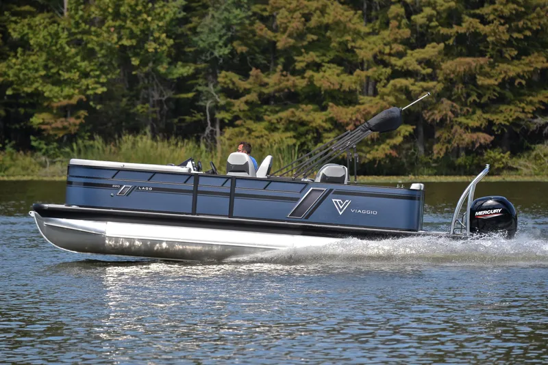Slide: The Image of 2023 Viaggio L22Q pontoon boat cruising on a lake. - 2