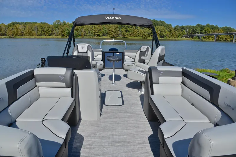 Slide: The Image of 2023 Viaggio L22Q pontoon boat with spacious seating on a serene lake. - 23