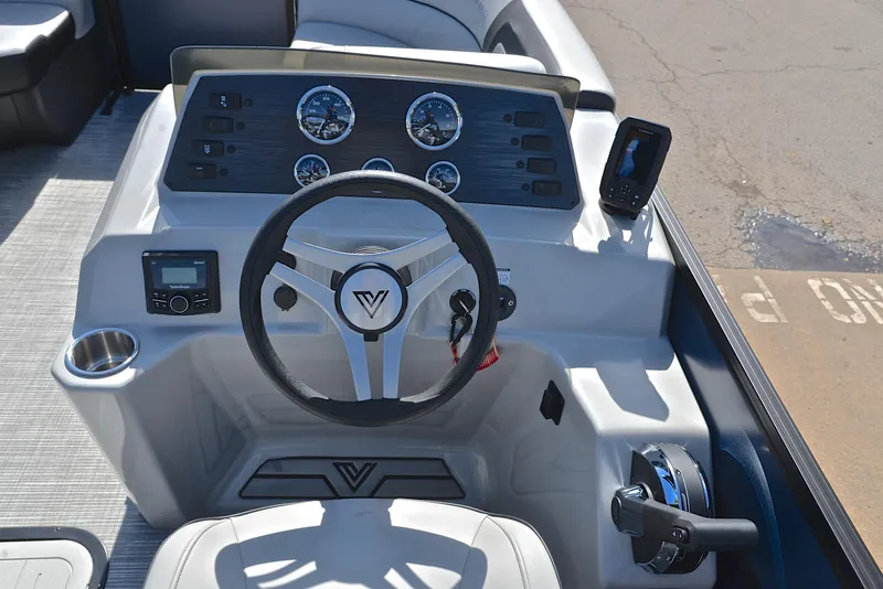 Slide: The Image of Viaggio L22Q 2023 boat dashboard with steering wheel, gauges, and controls. - 25