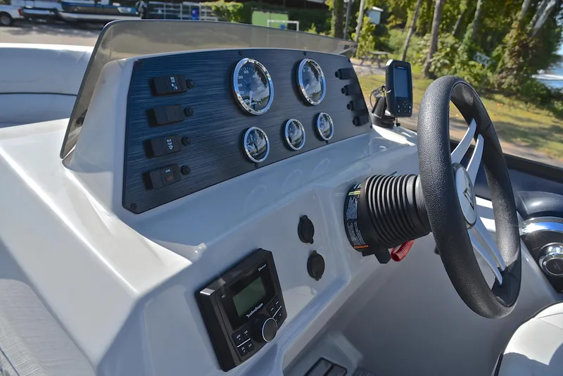 Slide: The Image of Control panel of 2023 Viaggio L22Q boat with steering wheel and gauges. - 26