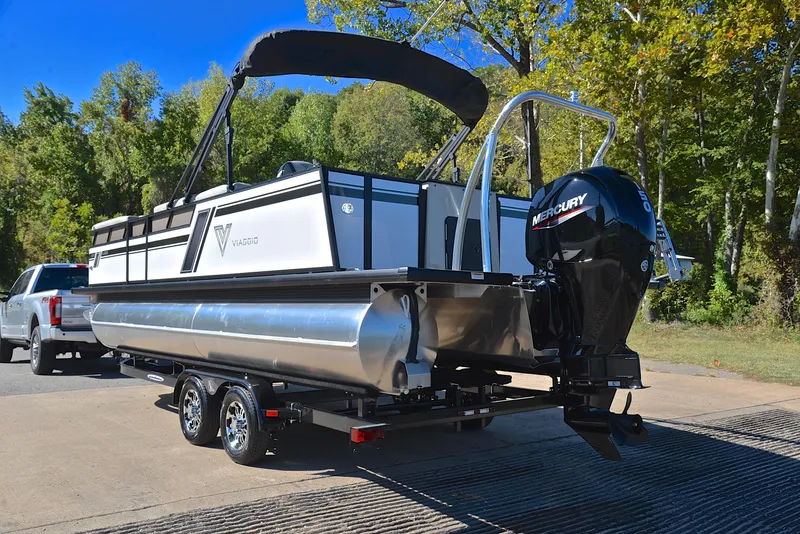 Slide: The Image of 2023 Viaggio L22R pontoon boat with Mercury outboard motor on trailer. - 12