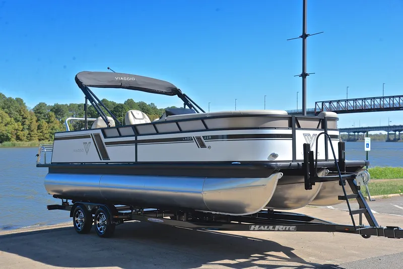 Slide: The Image of 2023 Viaggio L22R pontoon boat on trailer by the river. - 16