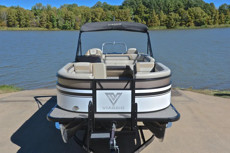 Slide: The Image of 2023 Viaggio L22R pontoon boat docked by a lake. - 17