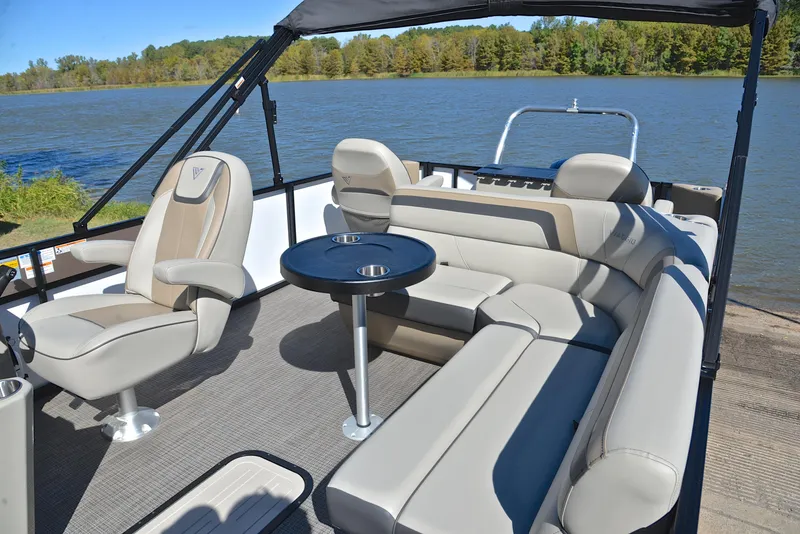 Slide: The Image of 2023 Viaggio L22R pontoon boat with luxurious seating on a lake. - 23