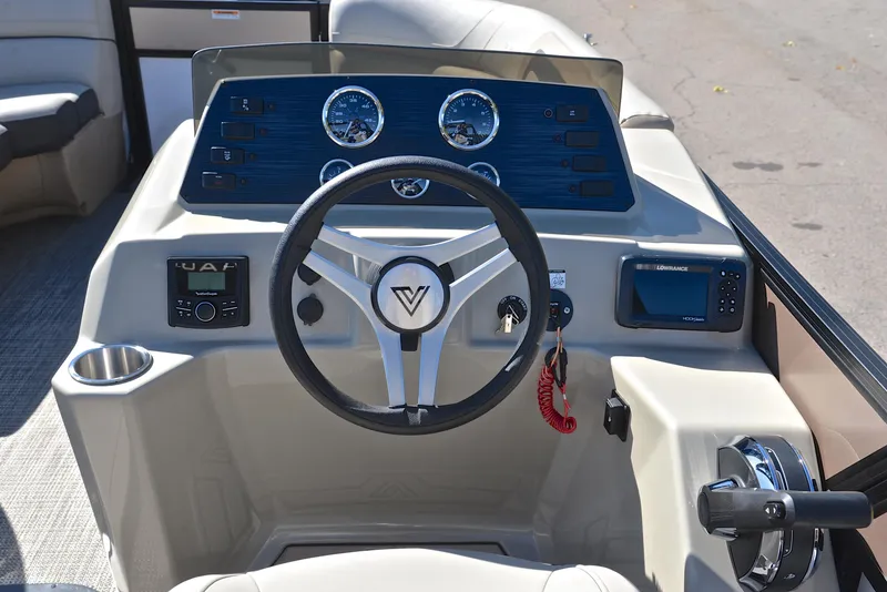 Slide: The Image of Viaggio L22R 2023 boat dashboard with steering wheel and control panel. - 26