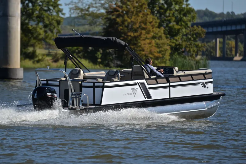 Slide: The Image of 2023 Viaggio L22R pontoon boat cruising on a lake. - 5