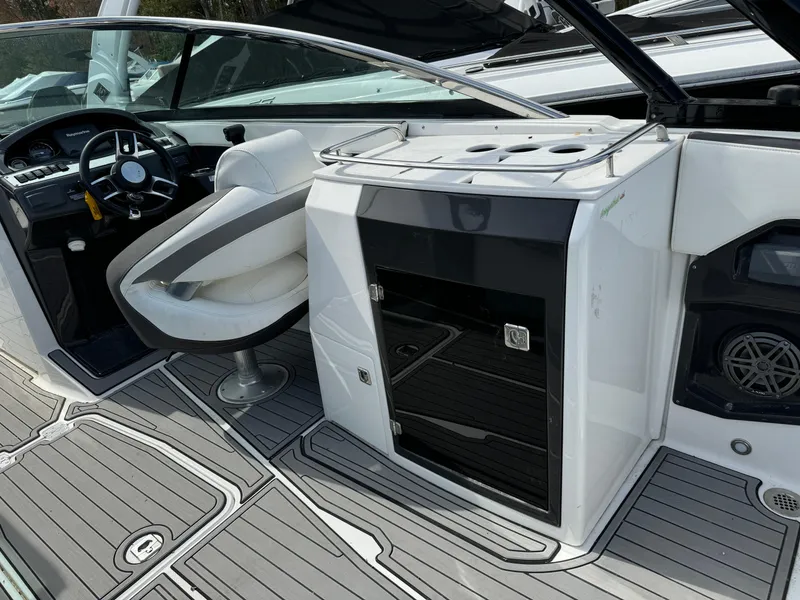 Slide: The Image of 2018 Monterey 278 Super Sport boat interior with captain's chair and control panel. - 14