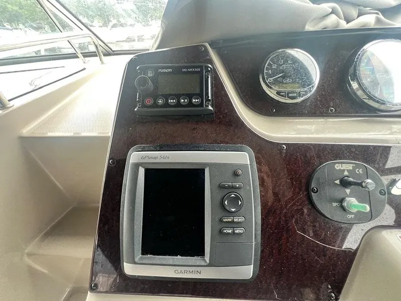 Slide: The Image of Control panel of a 2010 Sea Ray 280 Sundancer boat with Garmin GPS. - 11
