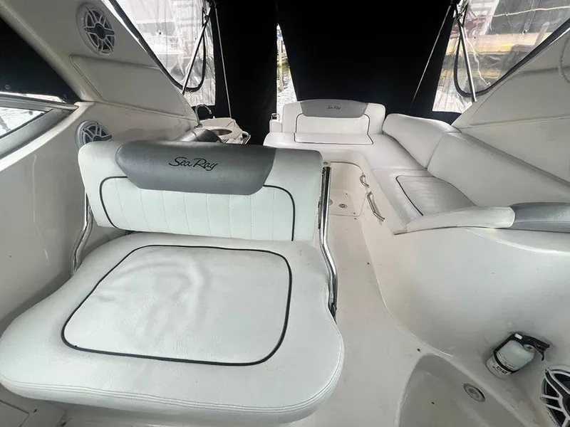 Slide: The Image of Interior of 2010 Sea Ray 280 Sundancer boat with white leather seating. - 15