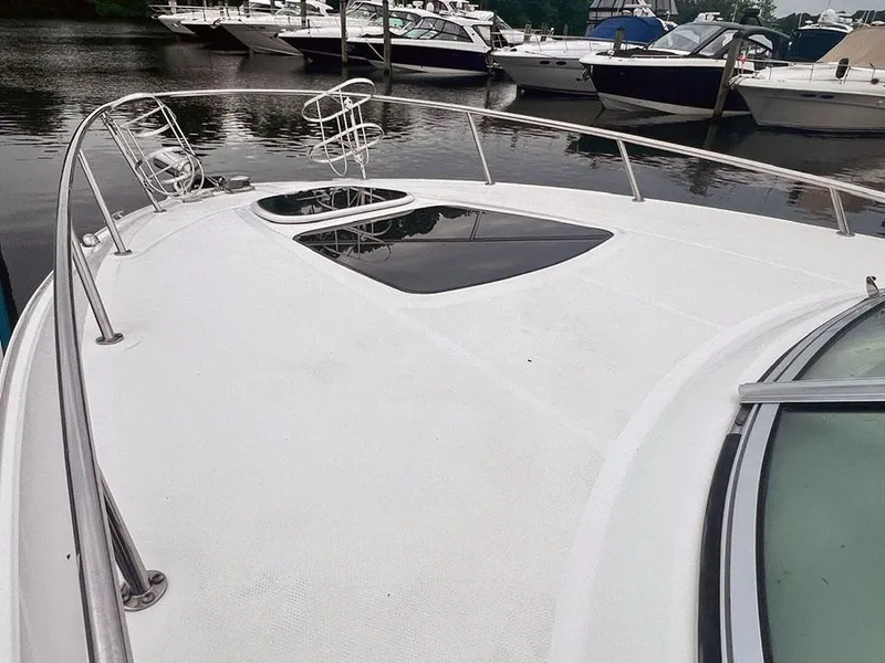 Slide: The Image of 2010 Sea Ray 280 Sundancer boat docked at a marina. - 3