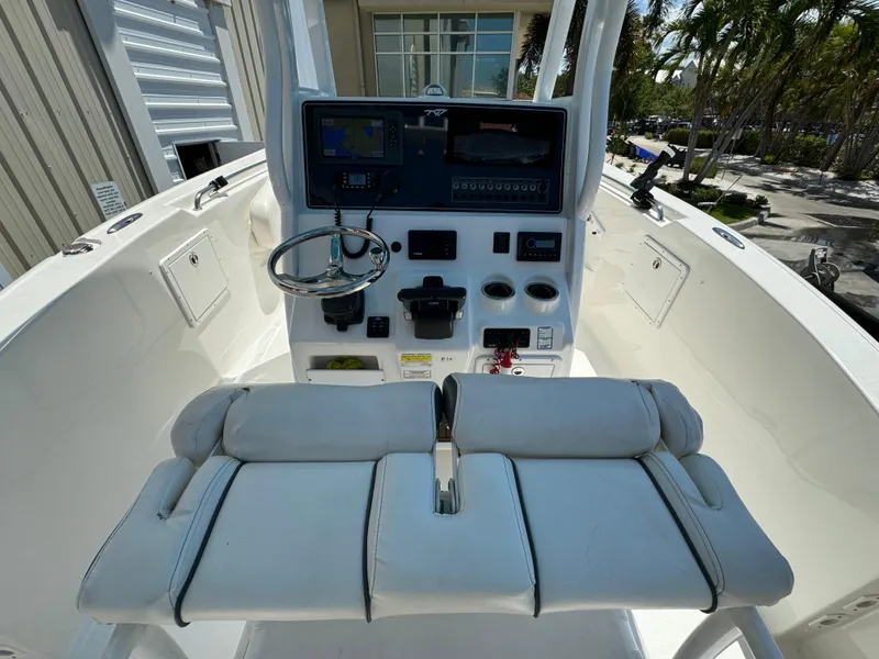 Slide: The Image of 2016 Tidewater 252 CC Adventure boat console with dual seats and navigation equipment. - 15