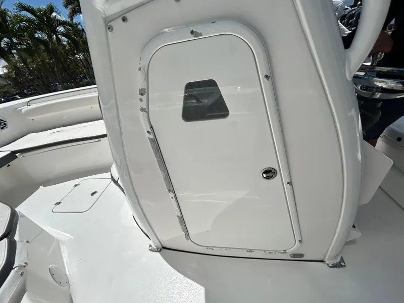Slide: The Image of 2016 Tidewater 252 CC Adventure boat console with storage compartment. - 22