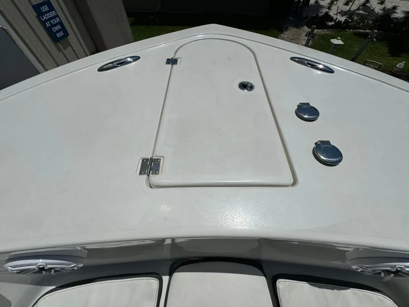 Slide: The Image of 2016 Tidewater 252 CC Adventure boat deck with storage hatch and fittings. - 27