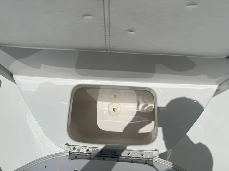 Slide: The Image of Open storage compartment on a 2016 Tidewater 252 CC Adventure boat. - 29