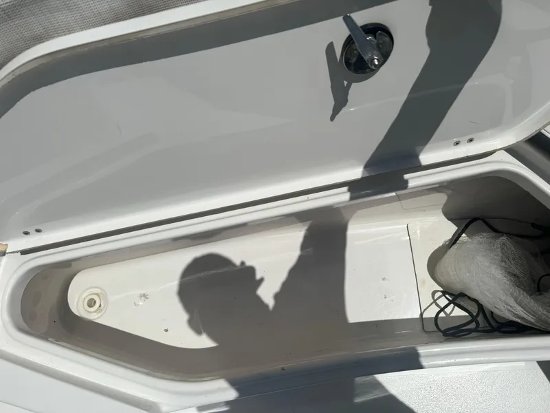 Slide: The Image of Open storage compartment of a 2016 Tidewater 252 CC Adventure boat. - 30