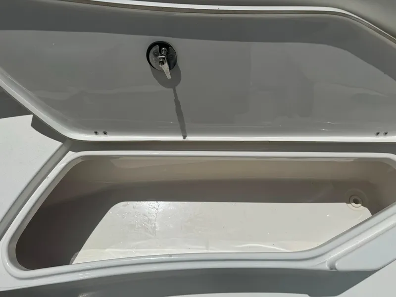 Slide: The Image of Open storage compartment on a 2016 Tidewater 252 CC Adventure boat. - 33