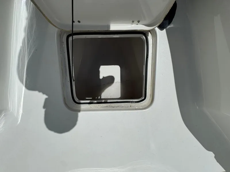 Slide: The Image of Open storage compartment on a 2016 Tidewater 252 CC Adventure boat. - 34