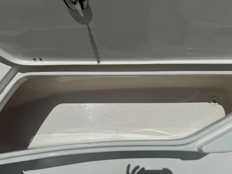 Slide: The Image of Open storage compartment on a 2016 Tidewater 252 CC Adventure boat. - 35