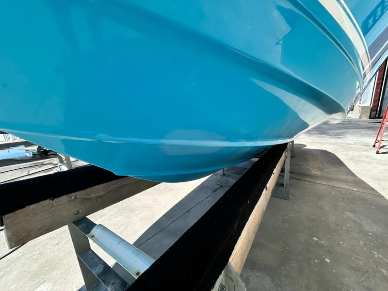 Slide: The Image of 2016 Tidewater 252 CC Adventure boat hull on trailer. - 6