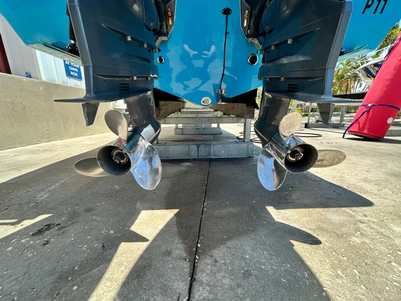 Slide: The Image of 2016 Tidewater 252 CC Adventure boat with dual outboard motors. - 9