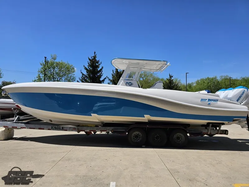 Slide: The Image of 2014 Deep Impact 36 Open boat on a trailer under a clear blue sky. - 10