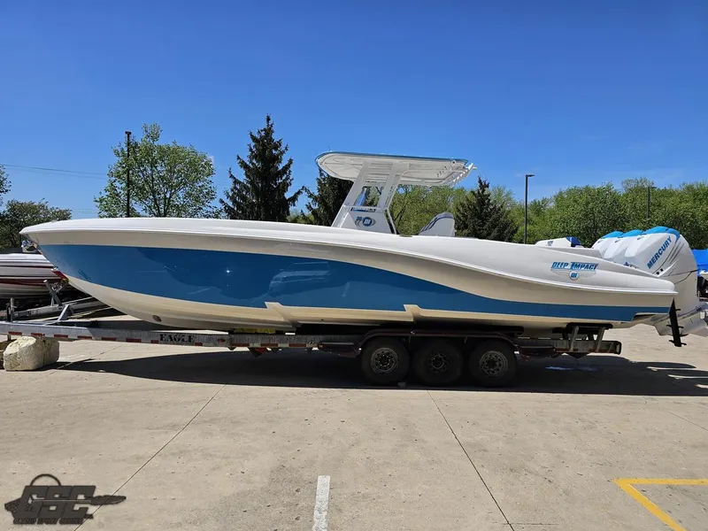 Slide: The Image of 2014 Deep Impact 36 Open boat on a trailer in a parking lot. - 11