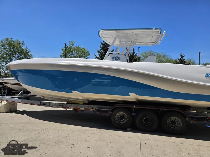 Slide: The Image of 2014 Deep Impact 36 Open boat on a trailer, blue and white hull. - 12