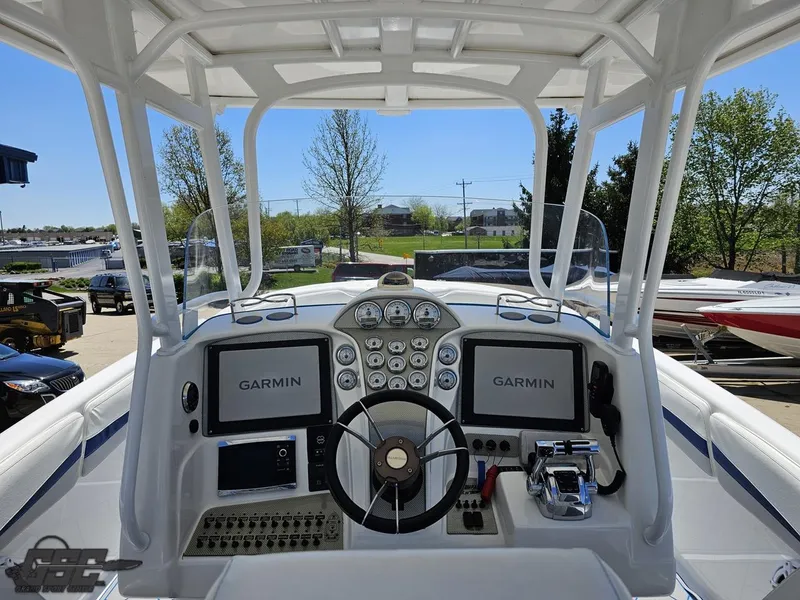 Slide: The Image of 2014 Deep Impact 36 Open boat dashboard with Garmin navigation systems. - 21