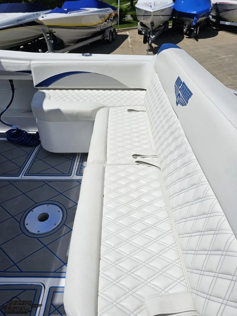 Slide: The Image of 2014 Deep Impact 36 Open boat with white diamond-stitched seating and blue accents. - 22