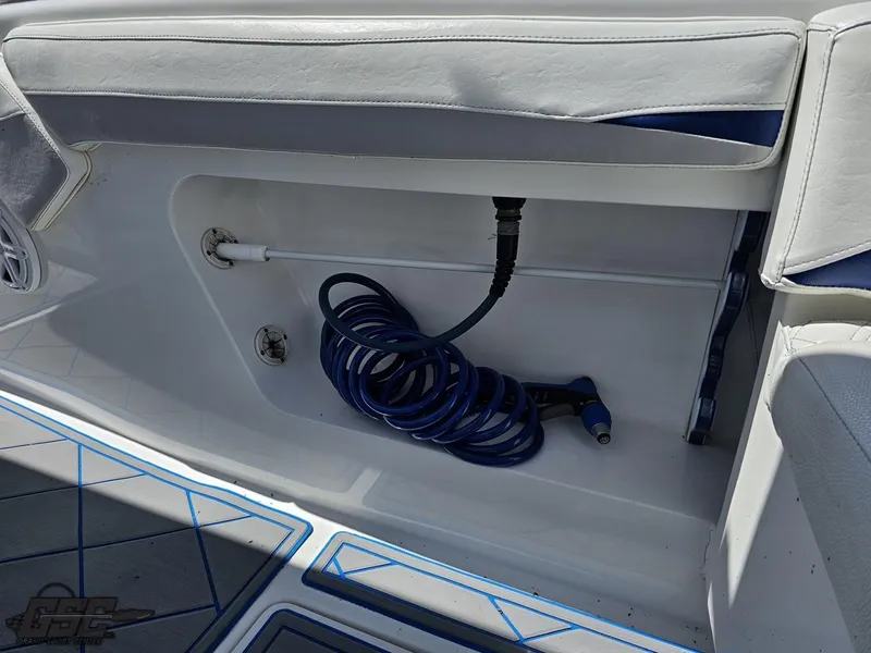 Slide: The Image of 2014 Deep Impact 36 Open boat interior with coiled hose storage. - 24